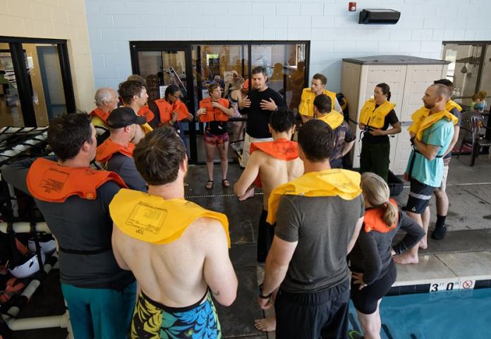 Group of individuals being instructed in a pool