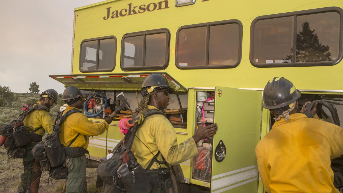 Firefighters putting on their gear