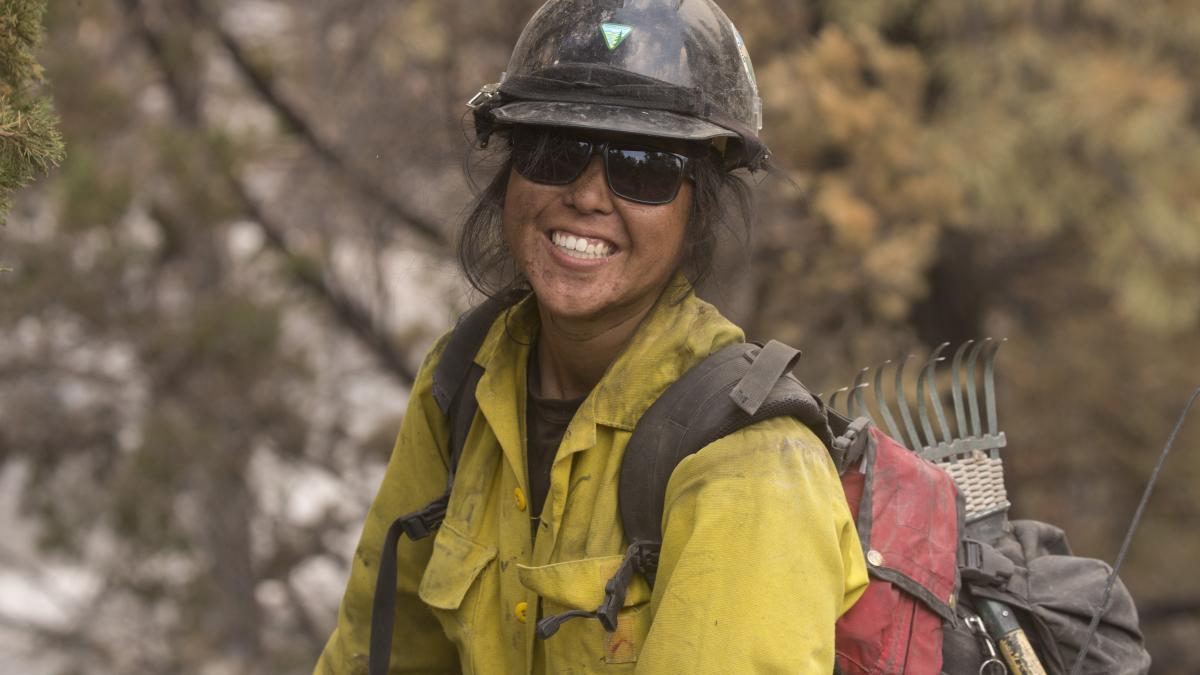 Firefighter in the field posing for the camera