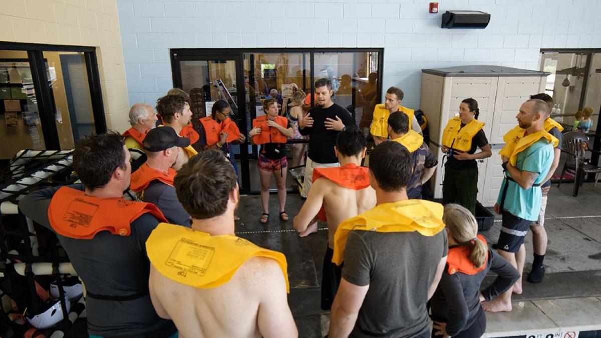 Group of individuals being instructed in a pool